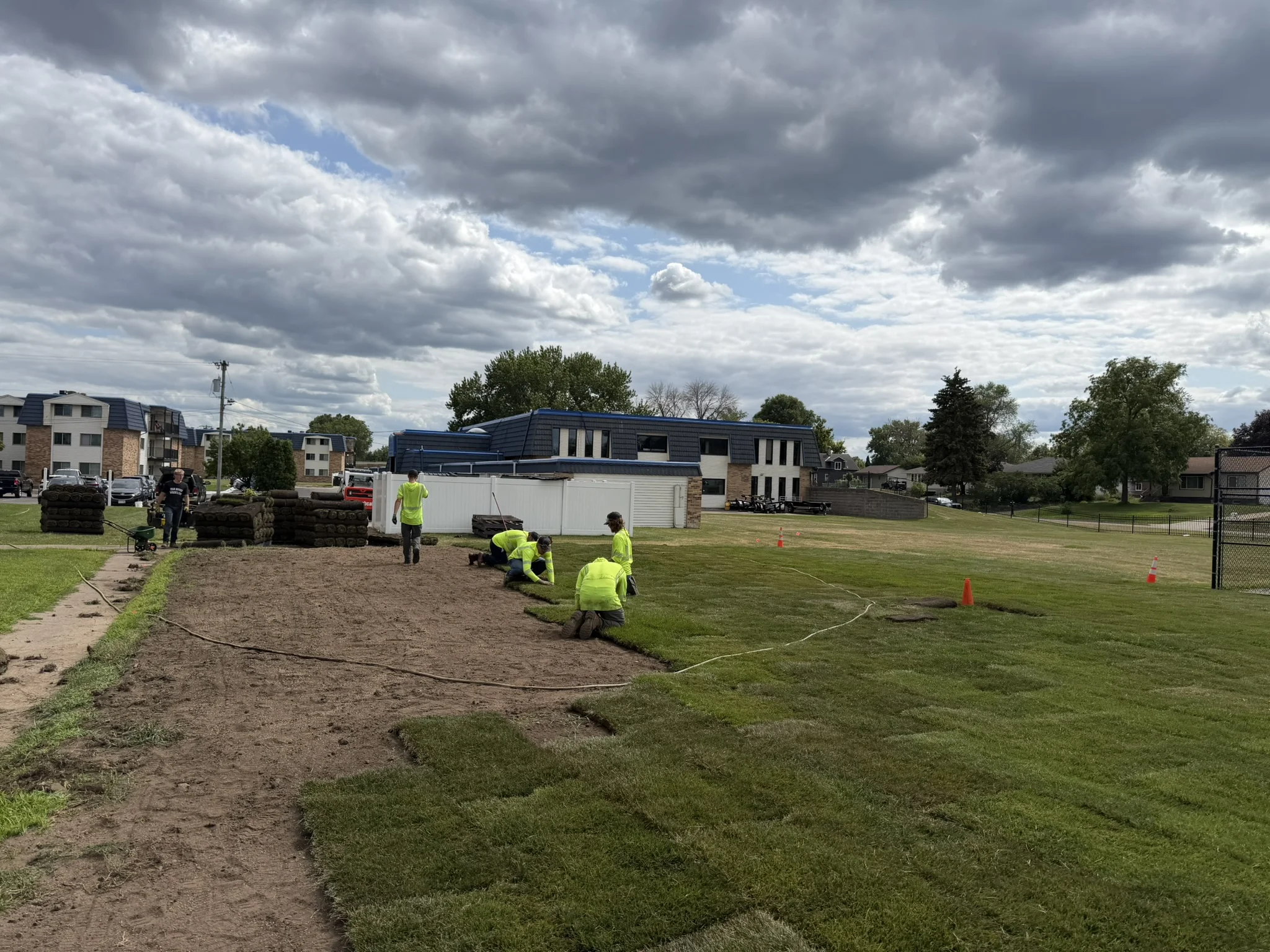 Clearline Outdoor crew installing sod at a multifamily property in Brooklyn Center, Minnesota