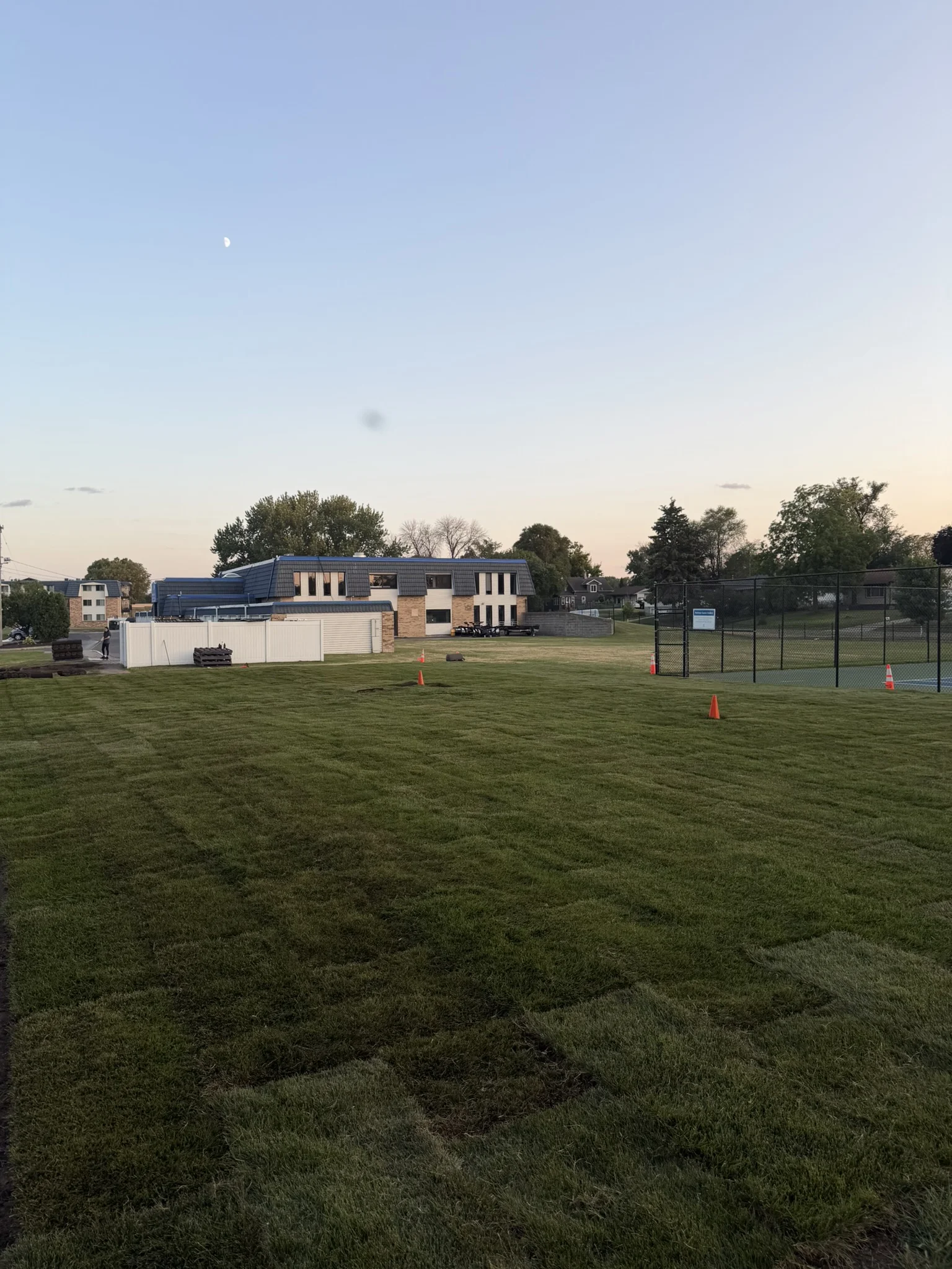 Completed sod lawn at Melrose Gates in Brooklyn Center, Minnesota, photographed at dusk