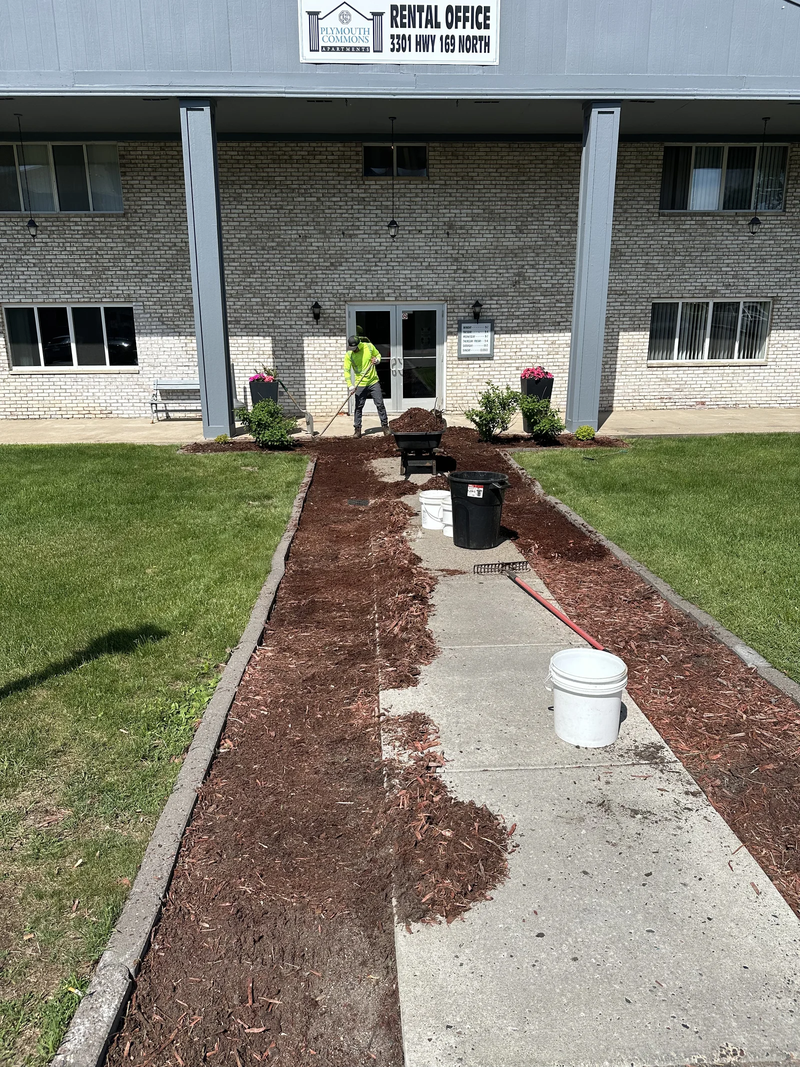 Bare walkway bed with fresh mulch just started at Plymouth Commons in Plymouth, Minnesota