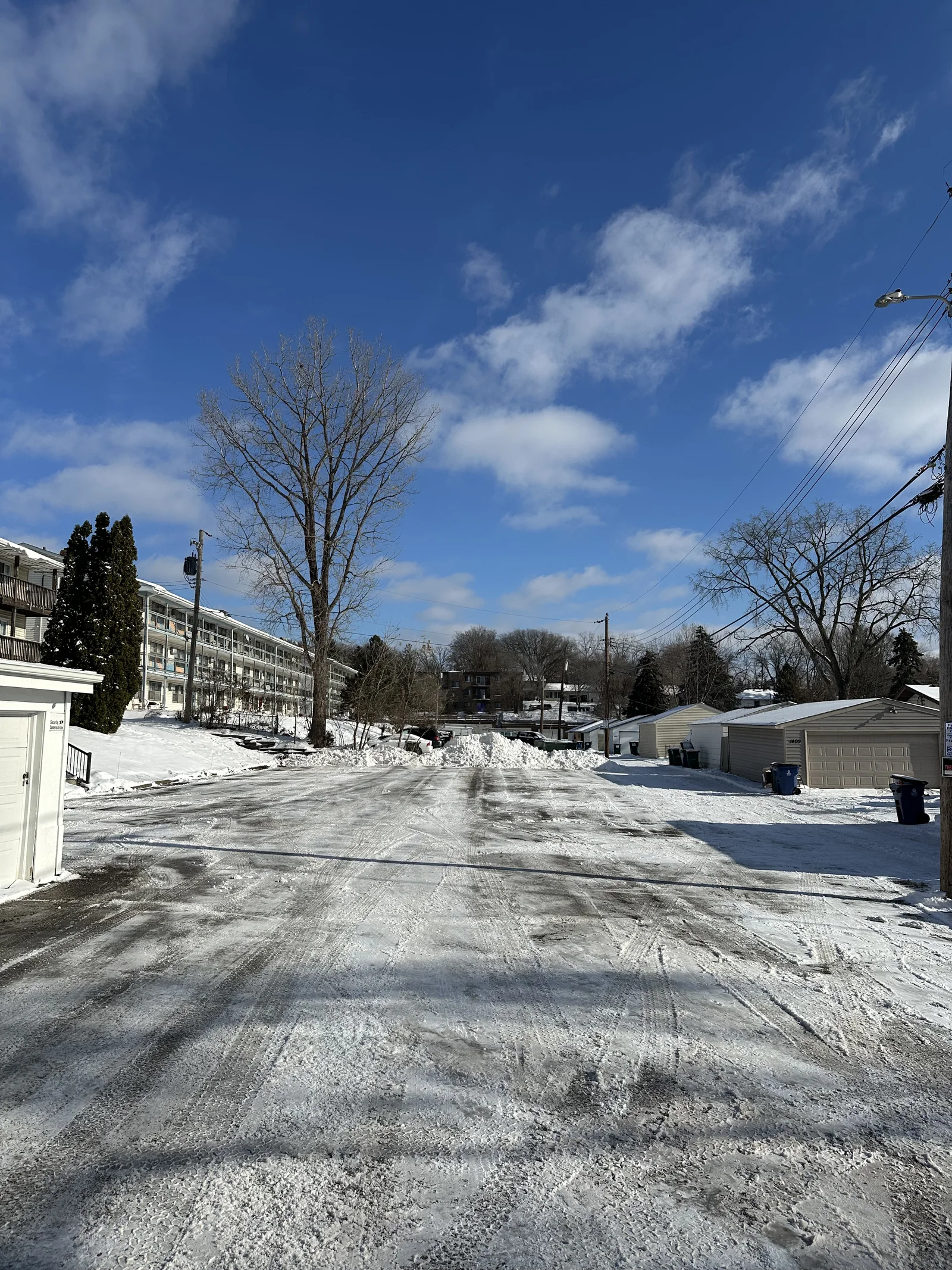 Cleared lot and driveway at 47th Ave Apartments in Columbia Heights, Minnesota after a winter snow removal visit