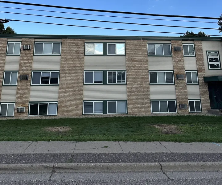Same building at Douglas Terrace Apartments with both trees removed and the facade fully visible