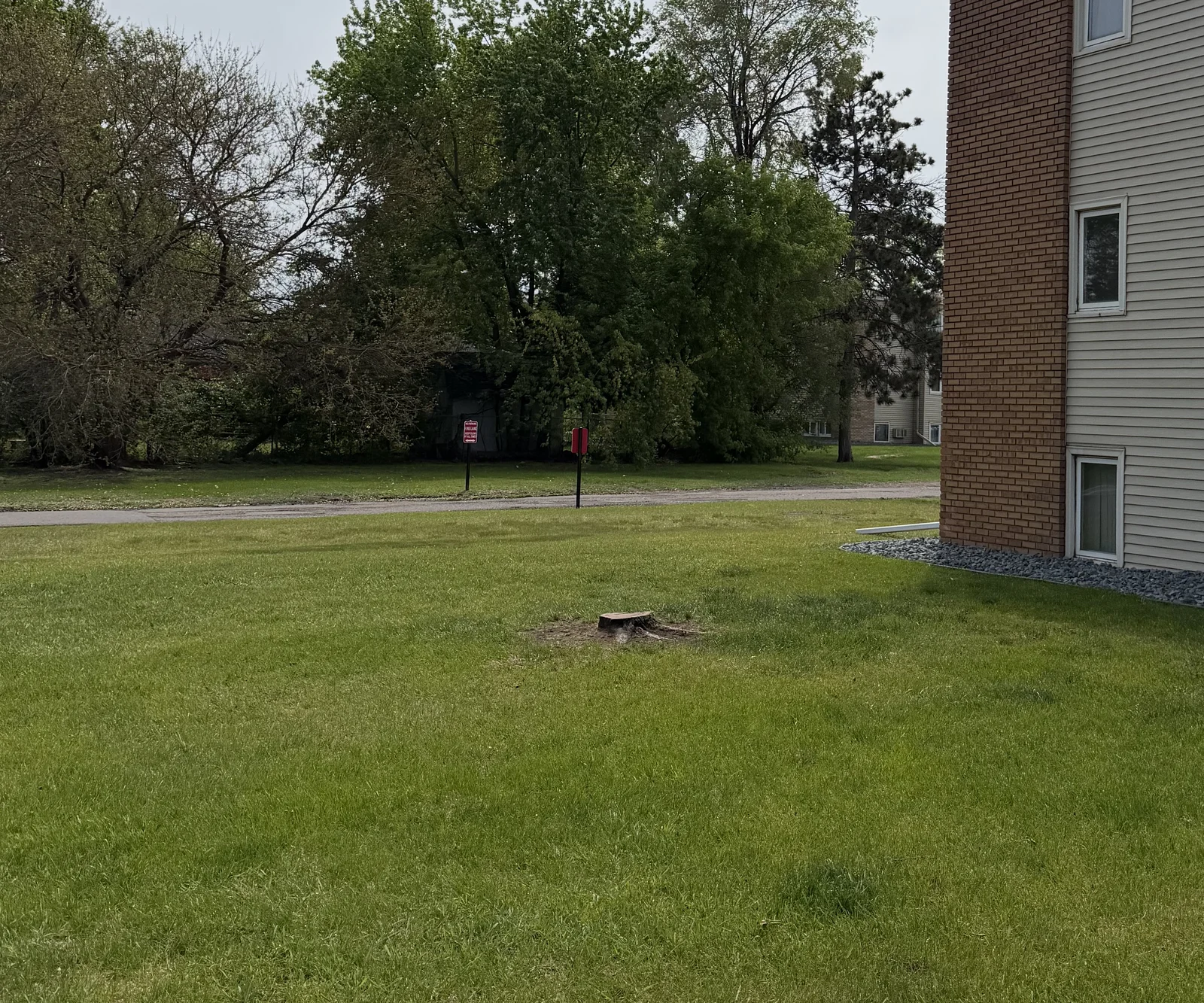 Same lawn at Park Place off Broadway with the tree cut down and removed